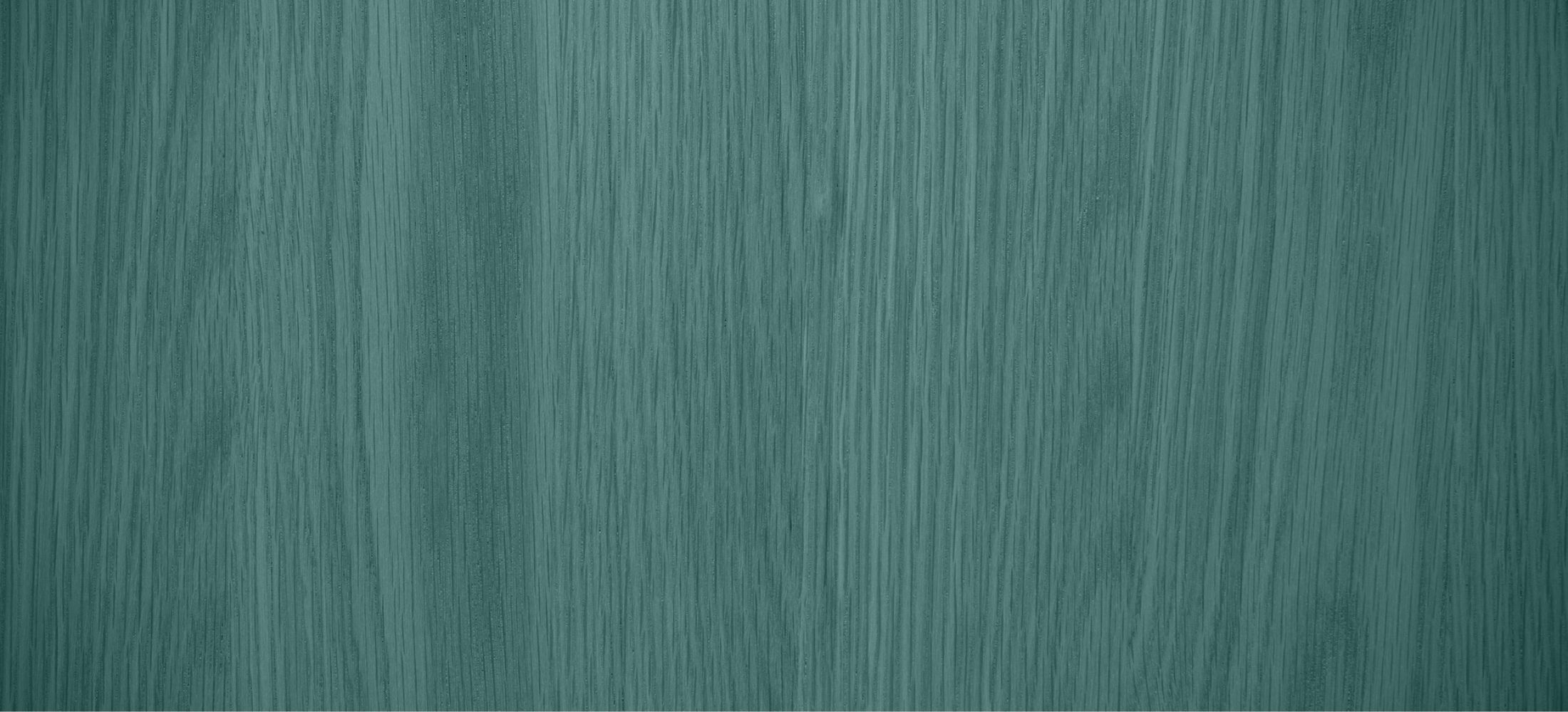 Textured teal wood surface background.